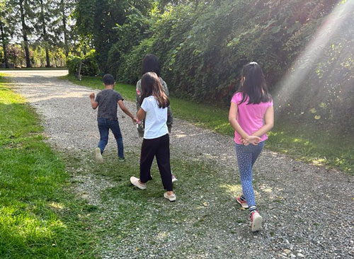 Family participating in a gardening and nature activity
