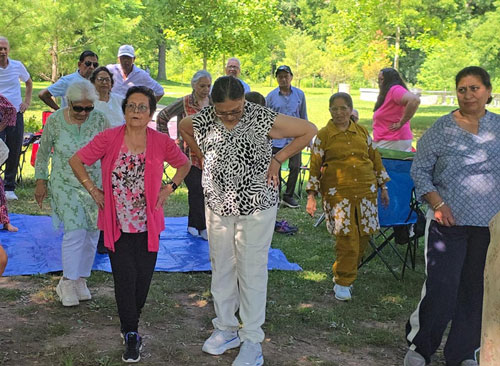 Family participating in a gardening and nature activity